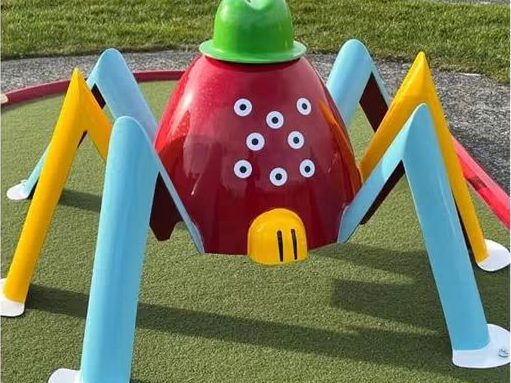 A large red spider obstacle on the crazy golf course