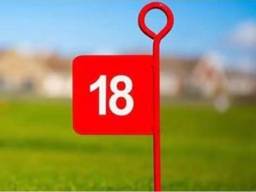 The red number 18 marker flag on the putting course