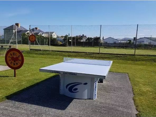 The outdoor table tennis table with the hills behind